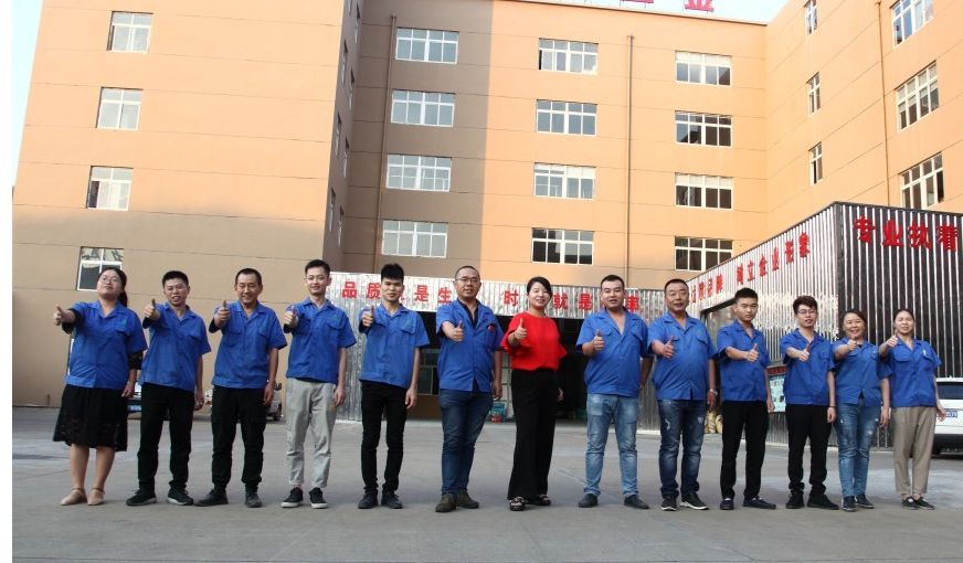 Staff in front of the factory building in Rui'an